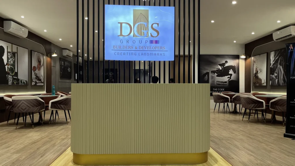 Symmetrical view of DGS Gurudarshan reception desk with client seating on both sides
