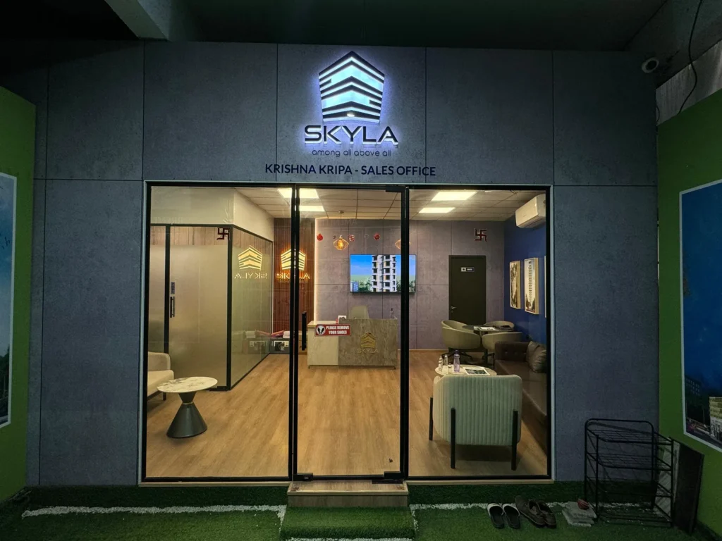 Illuminated Skyla sign above a glass shopfront opening onto the sales office